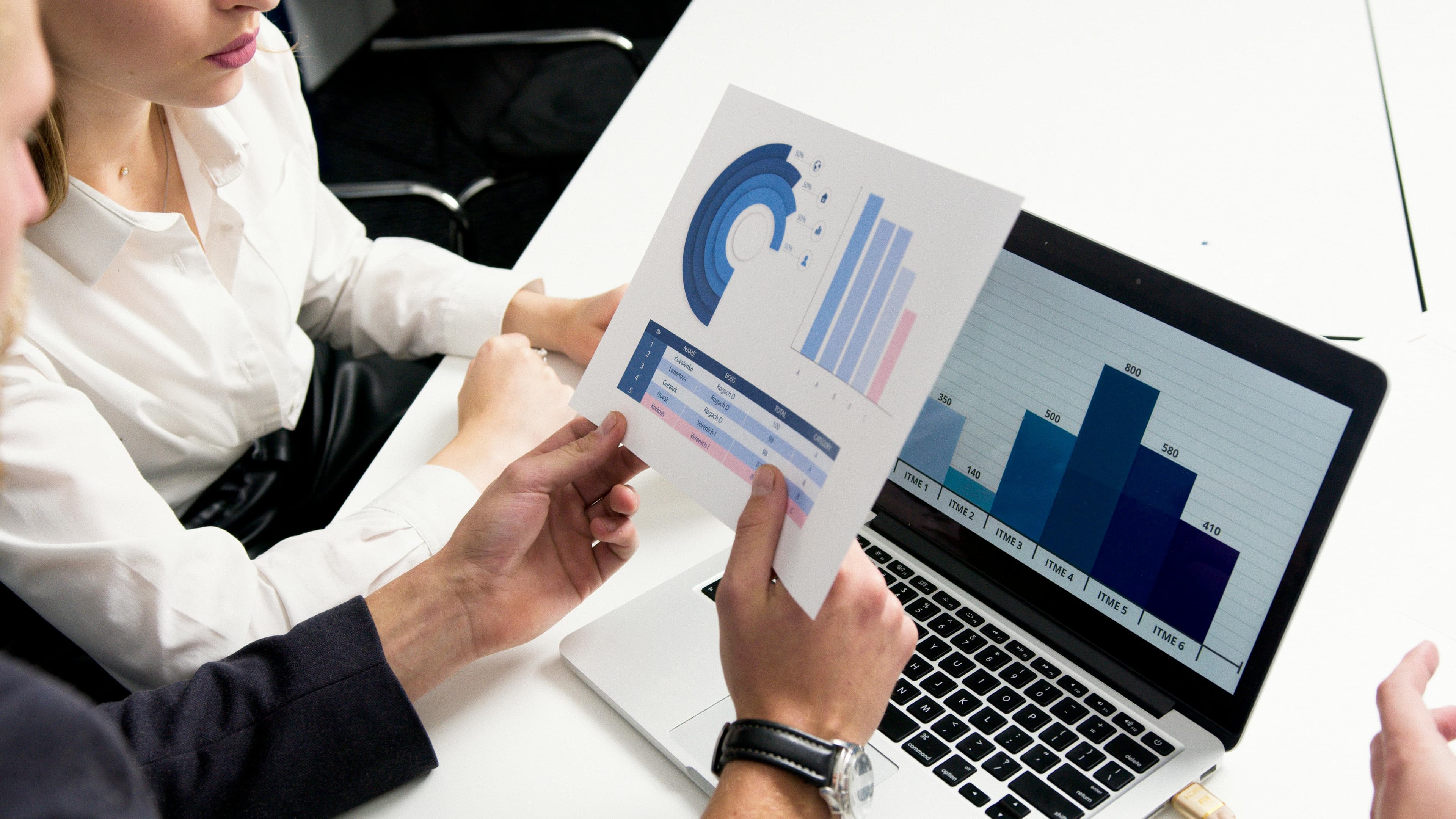 Person analyzing income growth charts and financial data