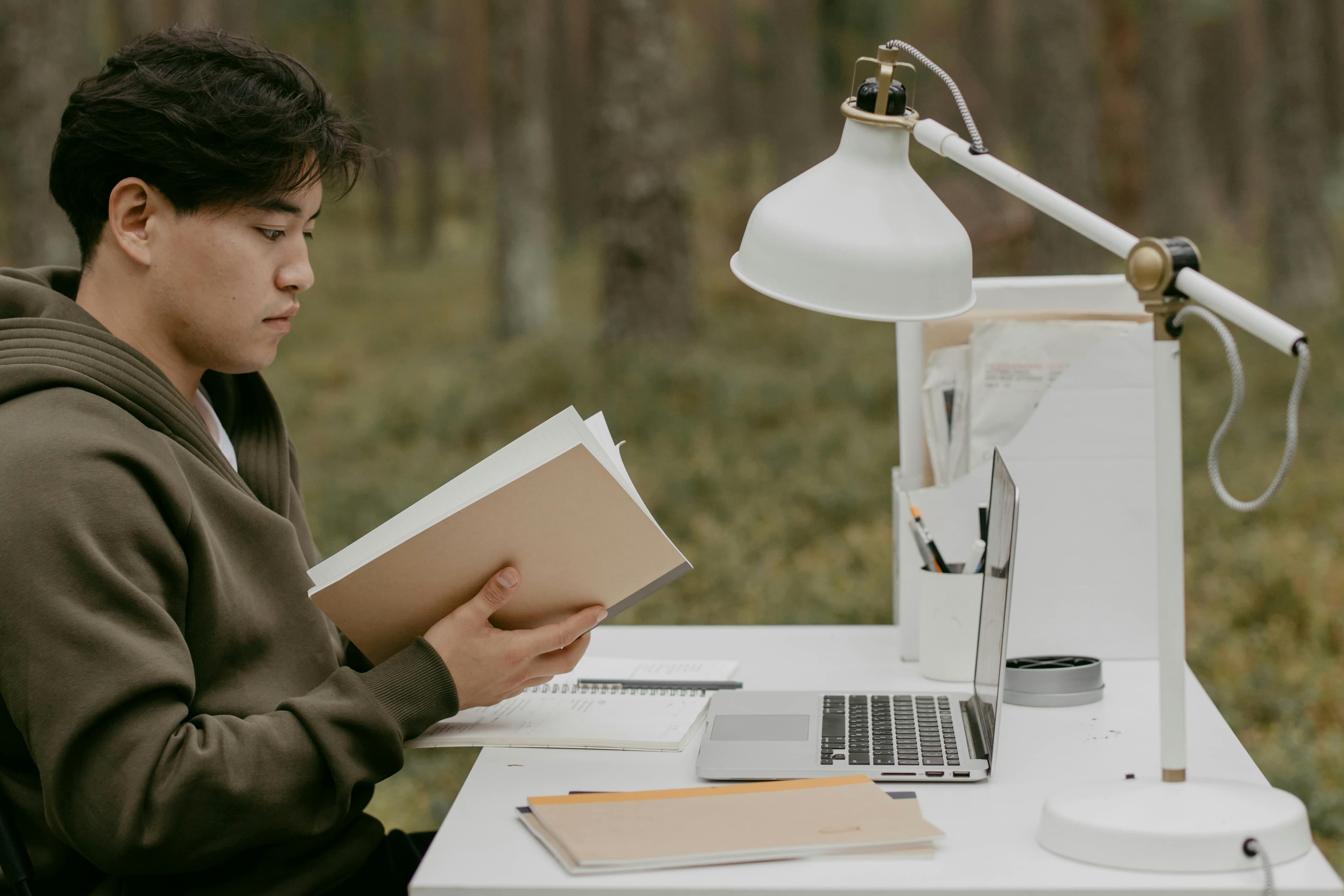 A freelancer organizing tax documents and receipts at a desk
