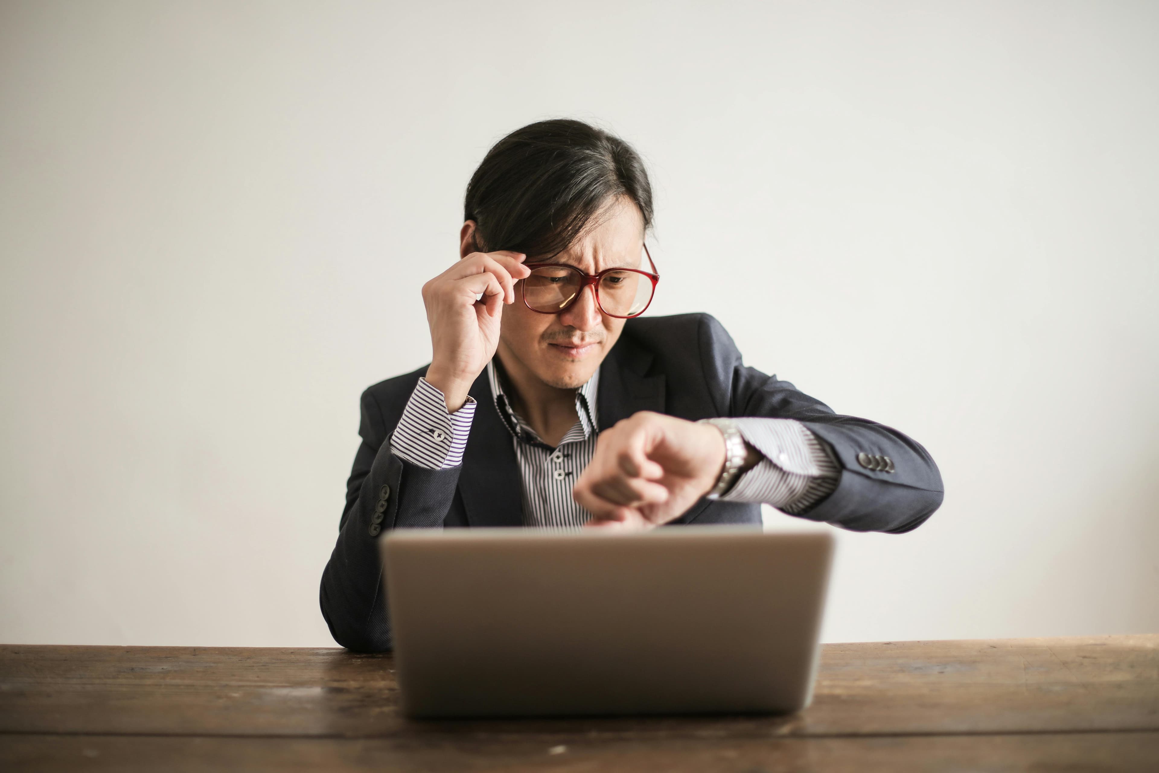 A person managing time efficiently with a calendar and clock